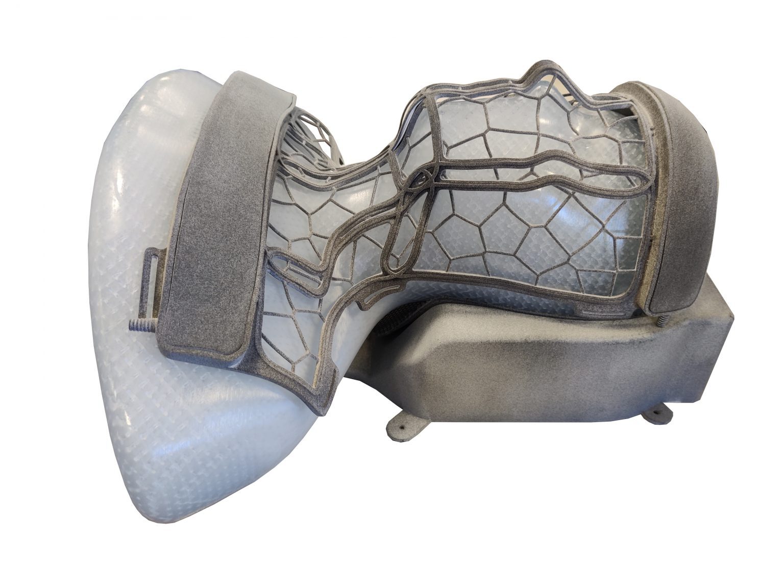 Photograph of a flexible RF receive coil with integrated composite structure for an MR-Linac — conformal cradle wrapping the patient interface, with the receive-coil network visible through translucent panels.
